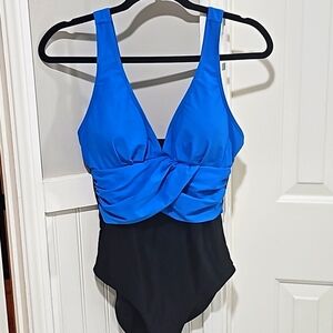 Women's size 6 medium one piece Swimsuit, blue and black v neck line